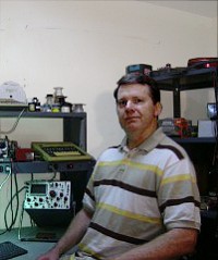 Frank Overstreet sitting at his home lab bench