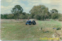 Frank Overstreet's younger brother operating a Ford Dexter diesel. Frank Overstreet's younger brother on Ford Dexter Diesel tractor.