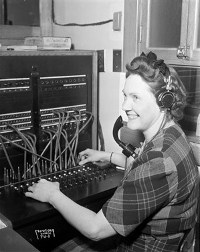 Old fashioned telephone switchboard operator